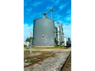 <b>TRACT #1 - GRAIN ELEVATOR</b>  (<b>SOLD - 9/9/16 $110,000</b>)
Note:  The grain bins, drier and legs are on R.R. leased property.  Mr. Voreis stated that lease payment is $900/year.

<b>Improvements - Grain Bins, Drier & Legs:</b>
1994     90,000 bu. bin with air tubes
1994     15,000 bu. hopper bin
               7,000 bu. bin
             42,000 bu. bin with air tube
<b>Drier:</b>  12'x45';1994 Zimmerman grain drier; S.S. 1,500 bu./hr. at 10 pts.;Natural gas
<b>Leg:</b>  1994 110' grain leg; 8,000 bu./hr.
<b>Drier Grain Leg:</b>  5,000 bu./hr.
<b>North Leg:</b>  7,000 bu./hr.
<b>Top Conveyor:</b>  1994 Chain Conveyor
<b>Bottom Conveyor:</b>  U-Trough Auger
<b>Dump Pit:</b>  Approx. 150 bu. with auger to leg

<b>Office:  Portable</b>  A 10' x 50' office with 2 separate offices, customer counter area, 1 restroom

<b>Grain Probe:</b>  A Hyd. Grain Probe

<b>Scales:</b>  10' x 60' Metal deck, scales, load cells, 100,000 lb. capacity, digital read-out and printer

<b>Quonset:</b>  A 41' x 120' metal Quonset building with concrete floor, top auger with 70,000 bu. capacity.

<b>Shop:</b>  A 22' x 40' wood frame with metal siding, concrete floor, heater

<b>Rail Siding:</b>  7+ Car rail siding along the east side of the grain bins.

<b>Utilities:</b>  City - Water and sewer; Electric - 480 (4) phase; Gas - Nipsco 

<FONT FACE="Arial, Helvetica, sans-serif" size="2" color="#0000FF"><b>TRACT #2 - STORAGE WAREHOUSE</b> (<b>STILL AVAILABLE</b>)

<b>2 Lots, Improvements</b>  60' x 112' wood frame structure, concrete floors, 4 doors, dock high load-out.</font face>



 - Grain Elevator (SOLD - 9/9/16) Storage Warehouse Still Available